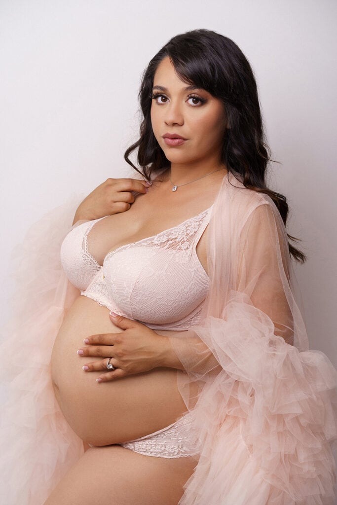 Mom in Pink Fluffy Robe Maternity Studio Photoshoot in Orange County.